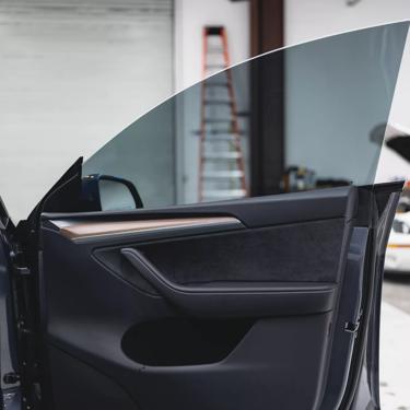 Professional car window tint installation close-up at Monster Auto Lab Vancouver BC — ceramic window film for heat rejection and UV protection